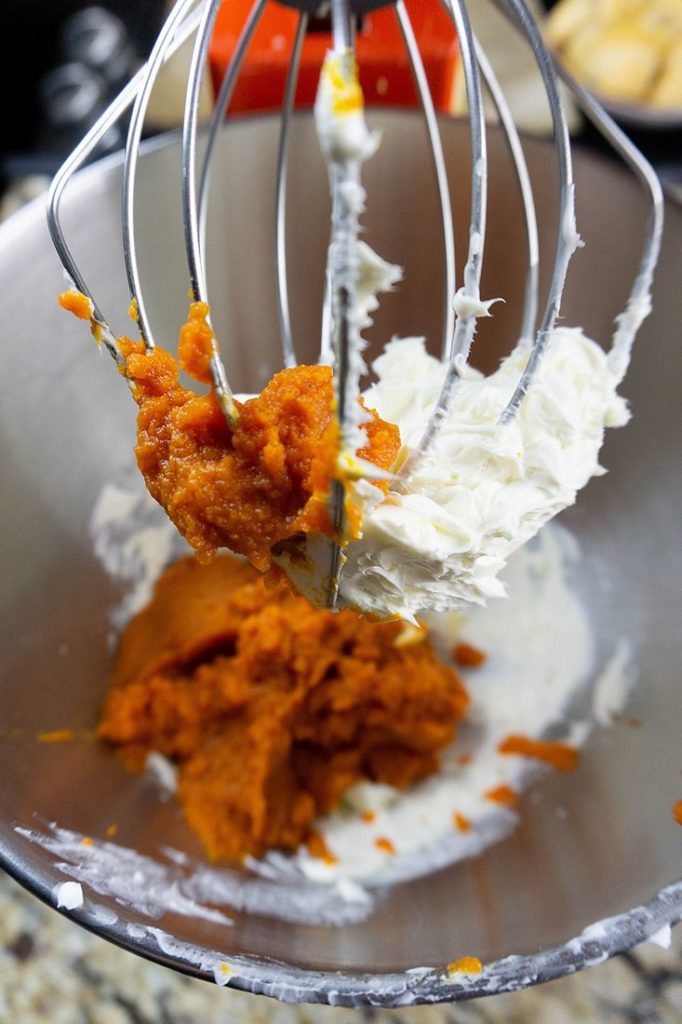 Pumpkin and cool whip in a KitchenAid stand mixer.