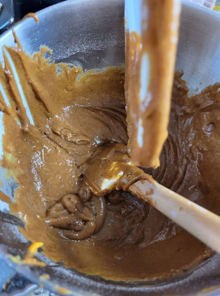 Ingredients for pumpkin whoopie pies mixed together in the stand mixer