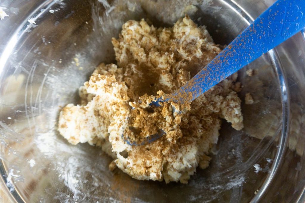 Golden oreos and cream cheese mixture in a bowl.