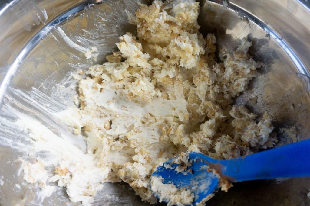 Golden oreos and cream cheese mixture in a bowl.