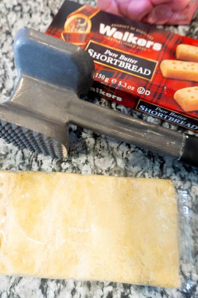 Shortbread and kitchen mallet on granite counter top