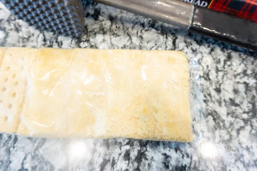 Shortbread and kitchen mallet on granite counter top