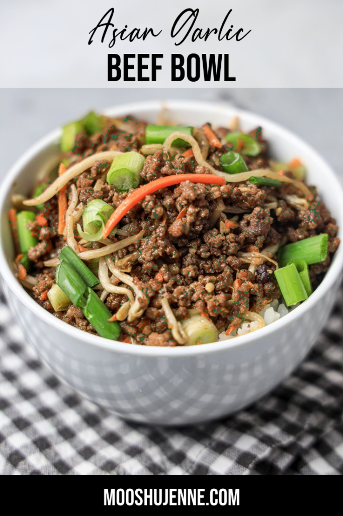 Beef in a bowl with mung bean sprouts, carrots, and spring onions. On a gray plaid napkin with concrete backdrop