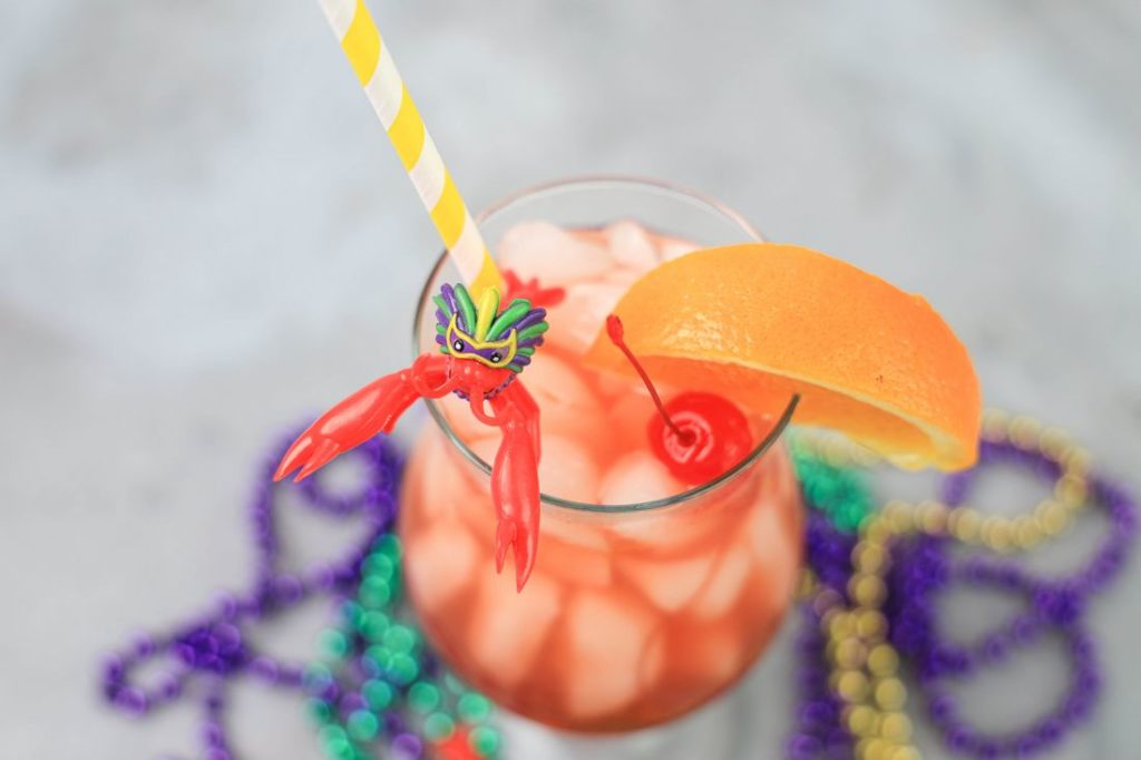 Hurricane cocktail is a staple of New Orleans and perfect to sip on for Mardi Gras. Made with light rum, dark rum, and passion fruit juice topped with a cherry and slice of orange. Add this drink to your Fat Tuesday list.