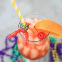 Hurricane cocktail is a staple of New Orleans and perfect to sip on for Mardi Gras. Made with light rum, dark rum, and passion fruit juice topped with a cherry and slice of orange. Add this drink to your Fat Tuesday list.