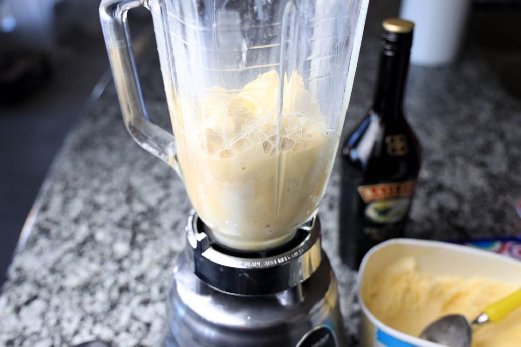 Bailey's, ice cream, and milk in a blender