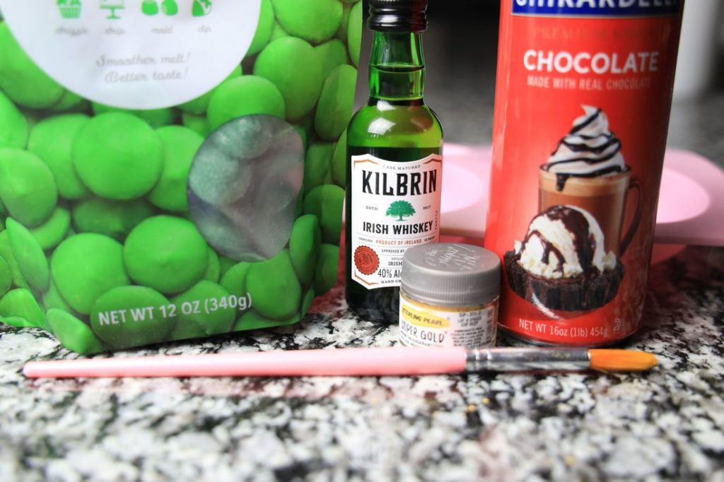 green candy melts, irish whiskey, pastry brush, and chocolate sauce