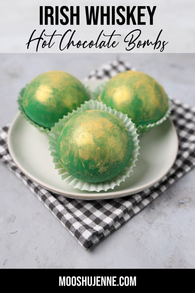 Green chocolate bombs dusted with gold dust and filled with whiskey and chocolate sauce.