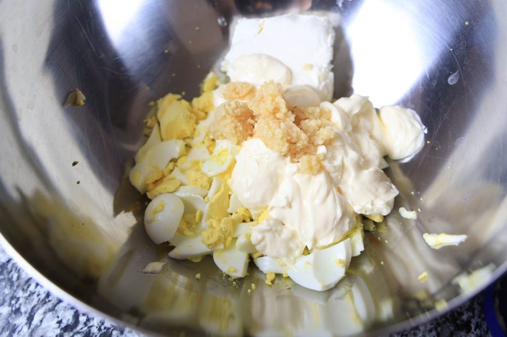 Eggs, Mayo, Cream Cheese, and garlic in a metal bowl