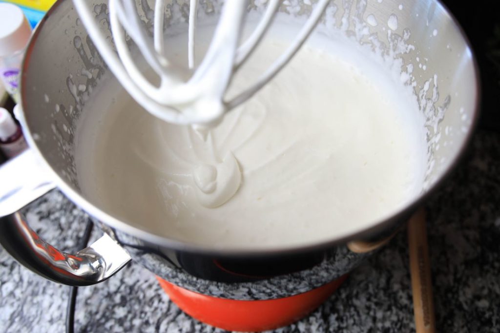 heavy whipping cream in a kitchen aid bowl