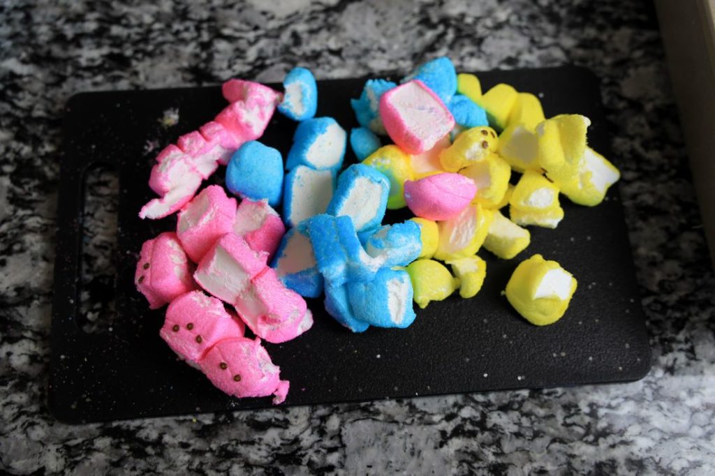 Peeps marshmallows cut up on a cutting board