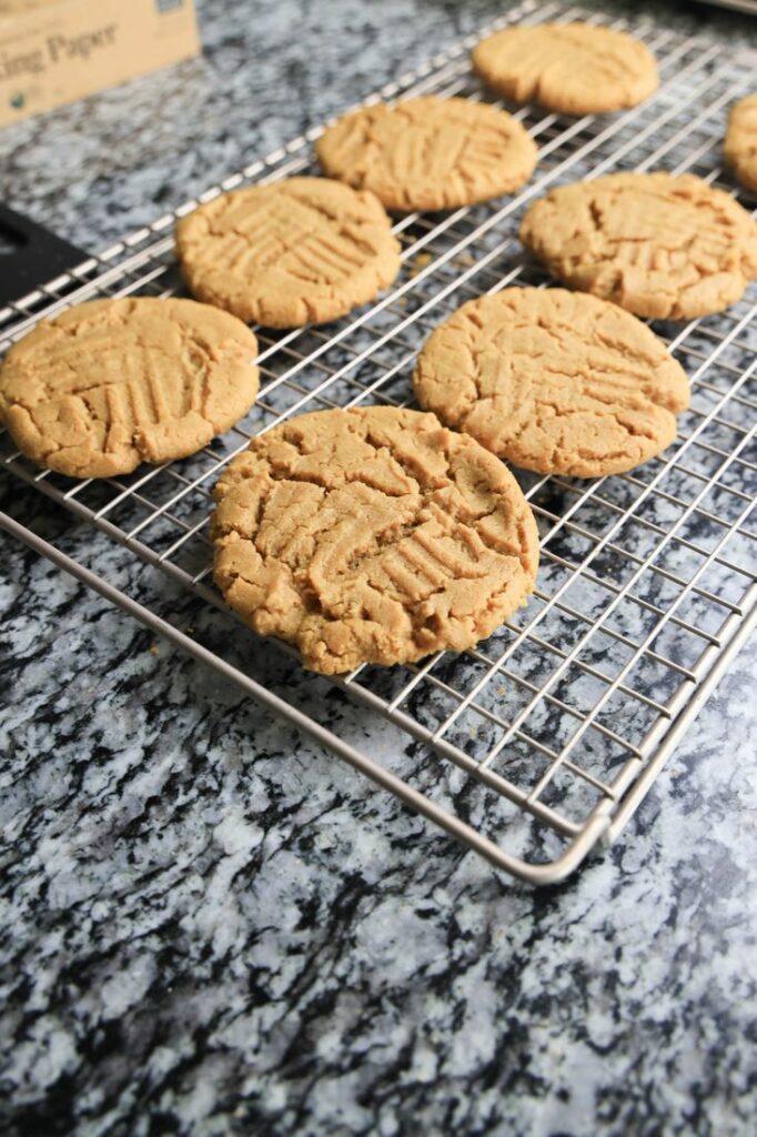 Peanut butter cookies cooling on a rack