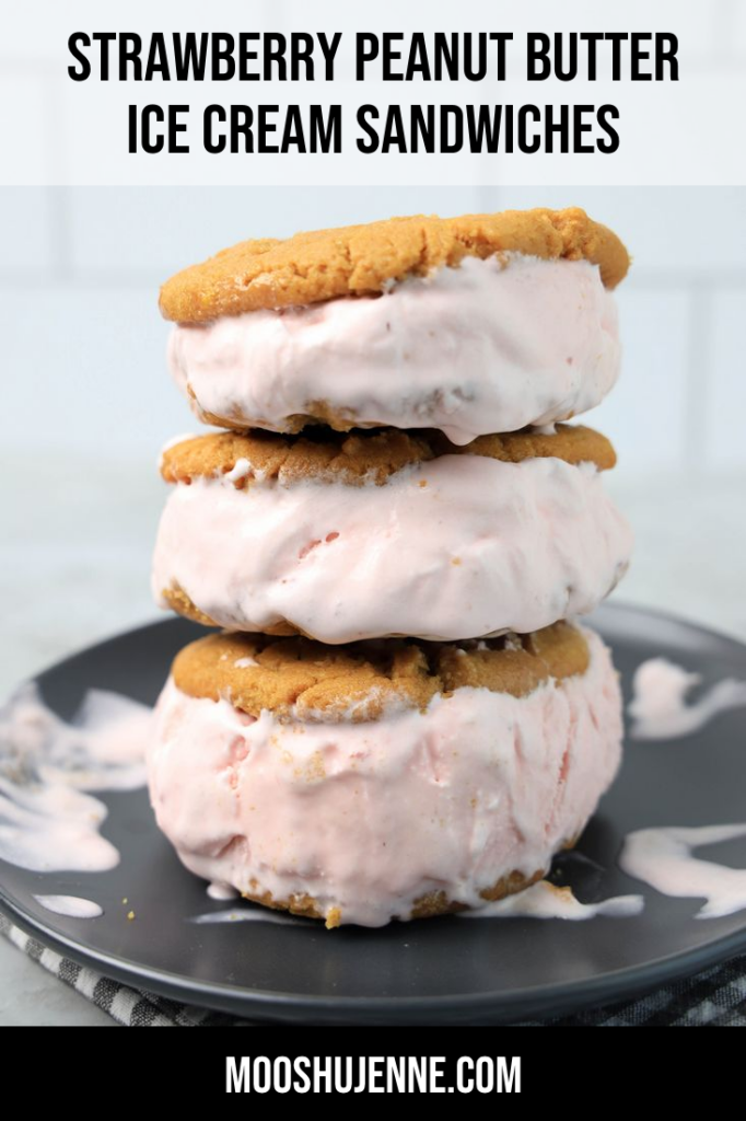 Strawberry Peanut Butter Ice Cream Sandwiches on a gray plate with a gray plaid napkin on a concrete backdrop