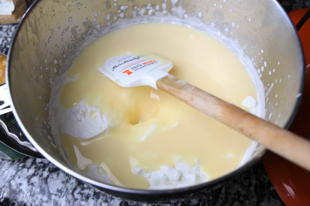 heavy whipping cream and sweetened condensed milk in the stand mixer.