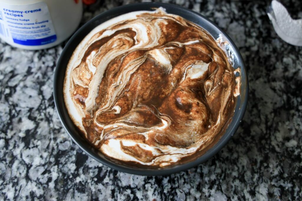 Marshmallow creme and melted chocolate swirled together.