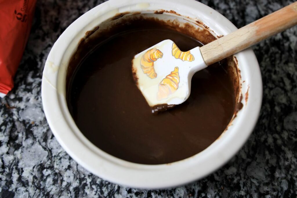 Melted chocolate in a stone bowl.