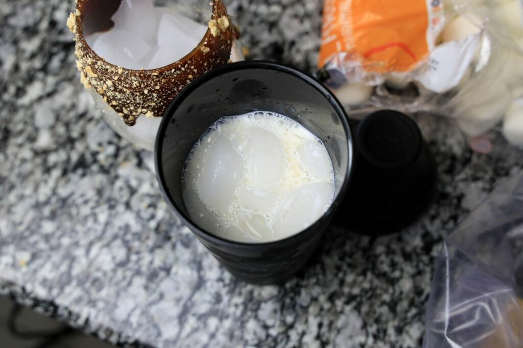 Milk, vodka, and irish cream in a shaker.