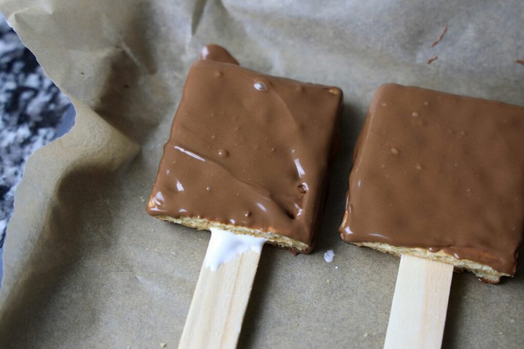 Graham cracker sandwich dipped into chocolate.