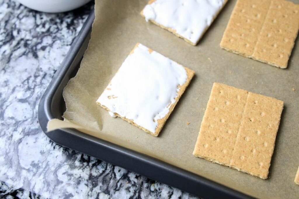 Graham cracker with marshmallow fluff on top.