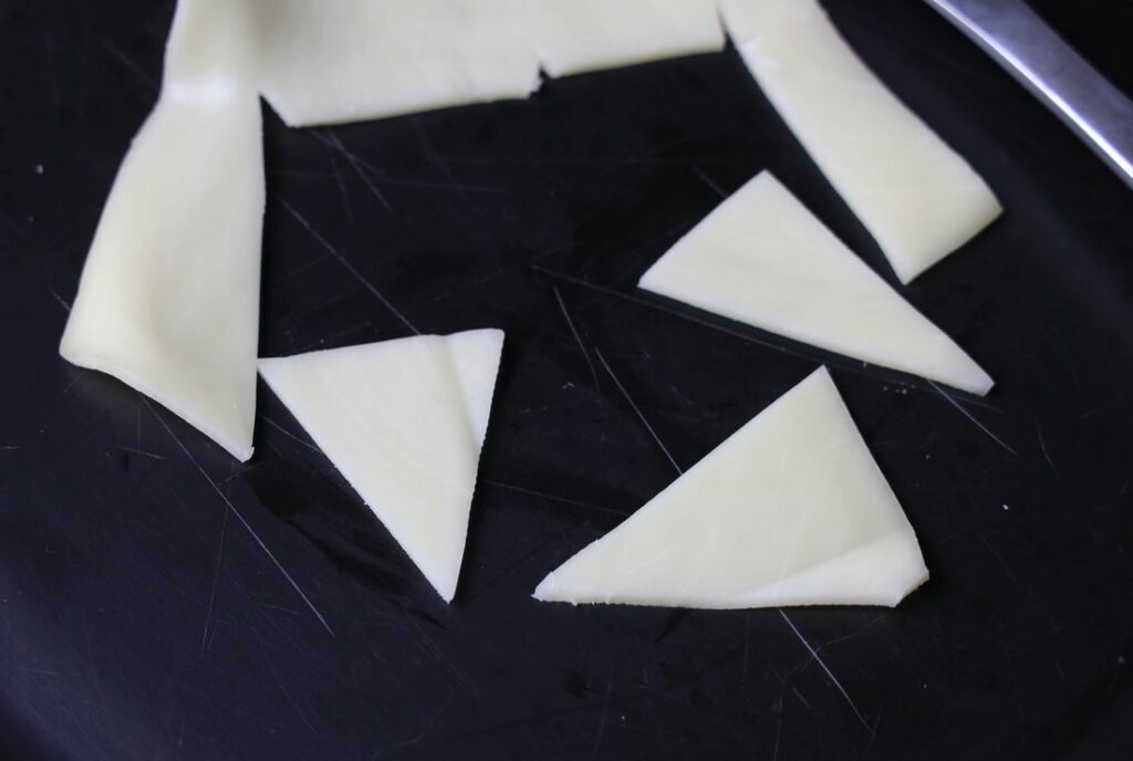 Mozzarella cheese cut into triangles.
