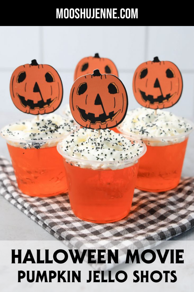 Halloween Movie Pumpkin Jello Shots that are orange topped with whipped topping and black sprinkles. With the 1978 Halloween Movie Pumpkin Topper.