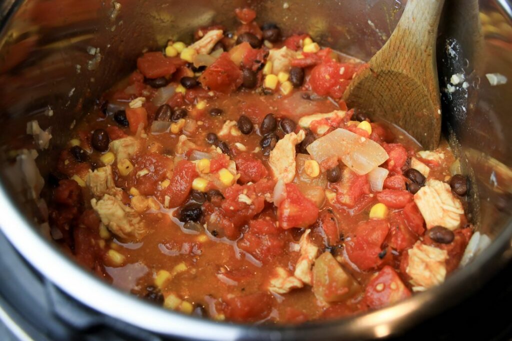 Chicken, corn, fire roasted tomatoes, and beans in the instant pot.
