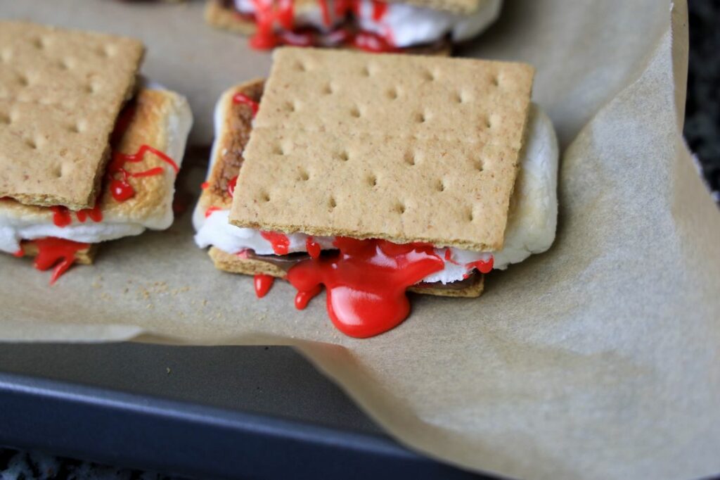 Oozing bloody s'more on parchment paper.