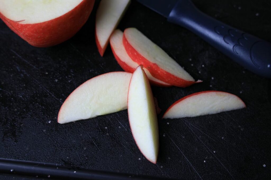 Honey crisp apples on a cutting board.