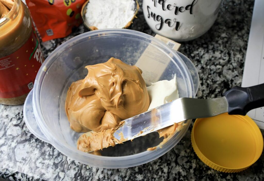 Peanut butter and cream cheese in a bowl ready to be mixed.