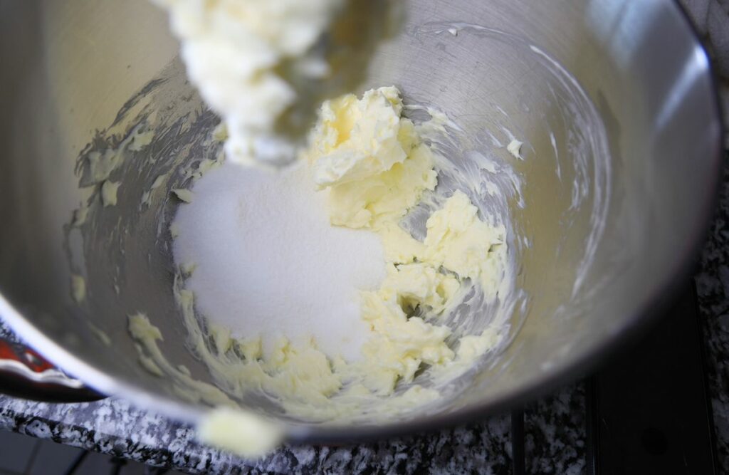 Butter and sugar mixed together in a stand mixer.