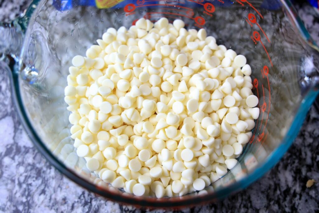 White chocolate chips in a 8 cup pyrex bowl.