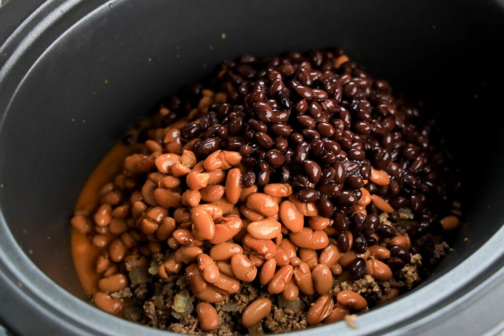 Beans and beef inside the crock pot.