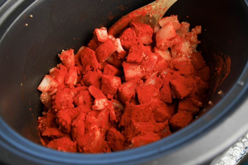 Paprika covered chicken in the slow cooker.