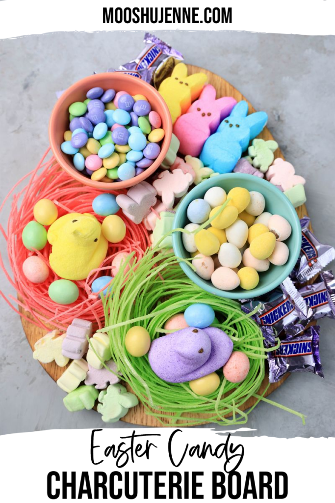 Easter Candy Charcuterie Board with peeps candy, cadbury eggs, and m&m's on an egg shaped board.