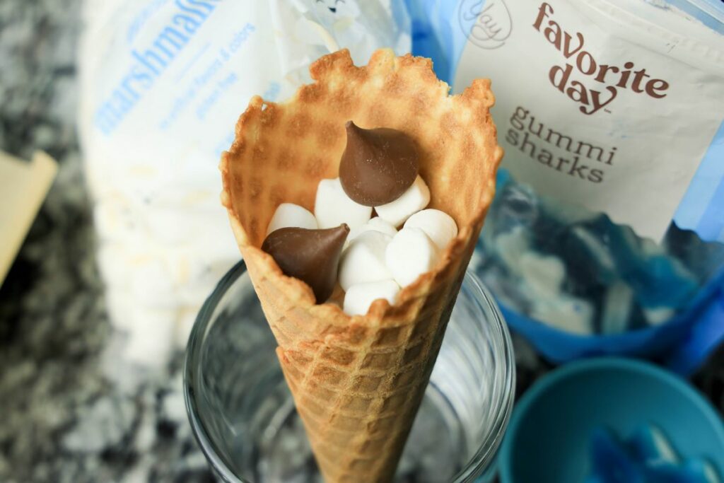 Waffle cone filled with chocolate and marshmallows.
