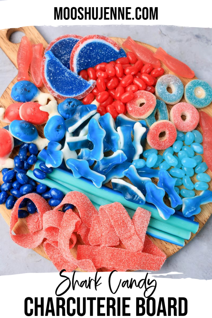Shark candy charcuterie board is a fantastic way to serve up some sweets for Shark Week. With shark gummies, Swedish fish, blue and red jelly bellies, and sour strips this board is sure to please.