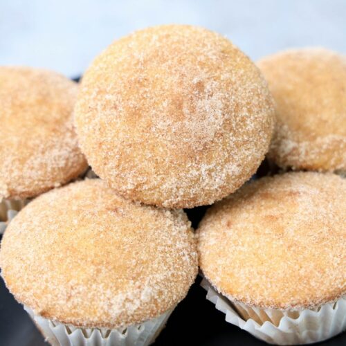 Apple Cider Muffins on a gray plate with a gray and white plaid napkin.