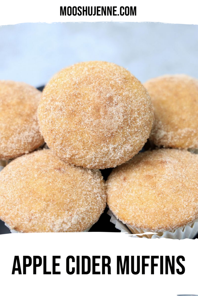 Apple Cider Muffins on a gray plate with a gray and white plaid napkin.