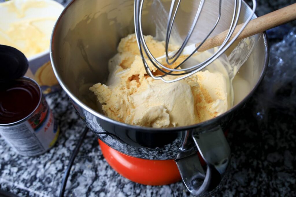Vanilla ice cream in a bowl of the stand mixer.