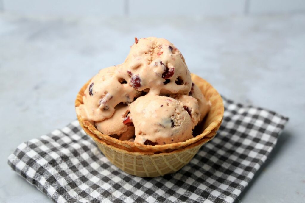 Cranberry ice cream is perfect for the holiday season. Sweet and tart with little ingredients to make. Make it in a stand mixer.