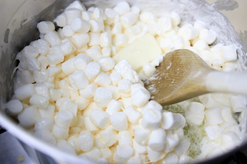 Marshmallows in a pot with butter to make popcorn balls.